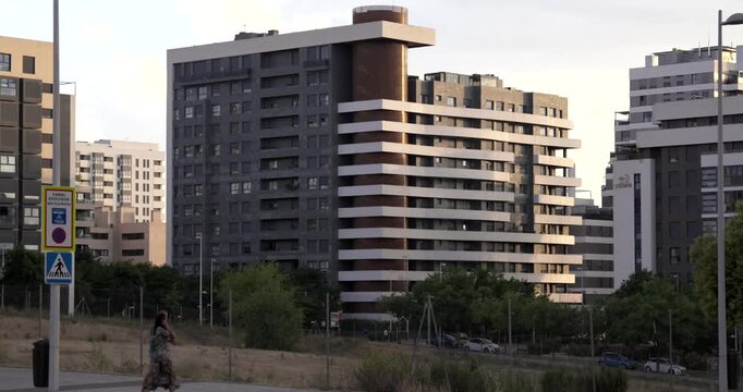 MADRID, SPAIN - June 2026: Modern residential apartment buildings and contemporary urban development in a growing district of Madrid. Evening light illuminates residential architecture and surrounding