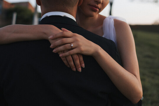 Bride and groom hugging 