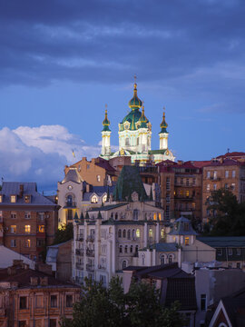 Suburb of Kyiv at dusk with historic church. 