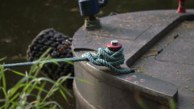 Boat tied with a rope on moorings