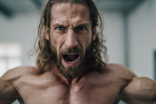 dynamic martial arts fighter showcases their passionate determination for victory in ring