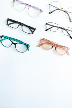 Glasses for vision on a white background in optical store. Vision test concept, stylish glasses concept