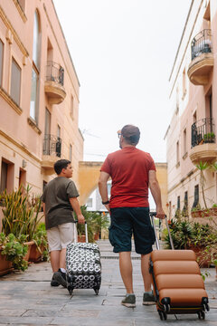 Father and son on arriving at the accommodation 