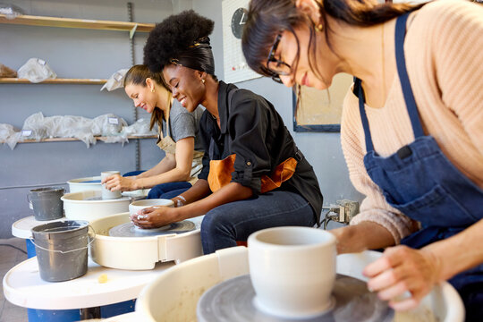 Three Women Work on Pottery