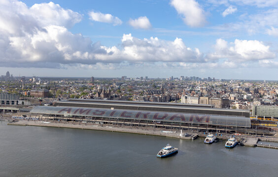 Aerial View of Amsterdam Central Station Waterfront With Ferries