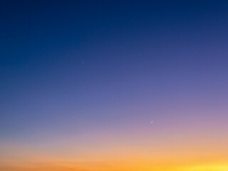 Venus, Jupiter, and Crescent Moon in Twilight Sky © Abdulkadir