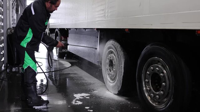 Professional cleaning of truck wheels and rims using high-quality foam and water services, ensuring a spotless shine. Perfect for automotive enthusiasts and detailing services.