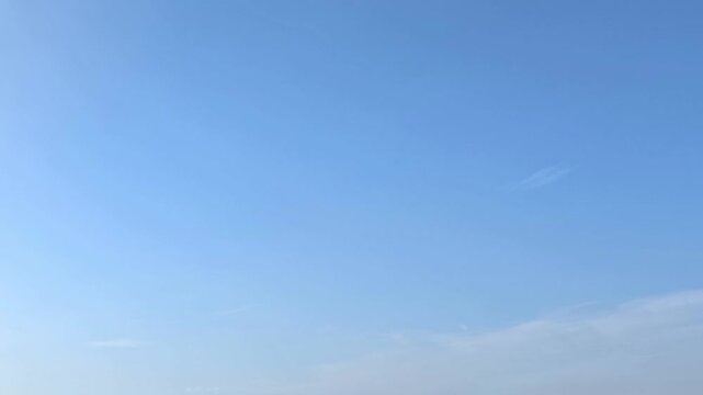 Cloudscape, Timelapse of Clear Blue Sky with Wispy Cirrus Clouds and Copy Space for Minimal Background Banner