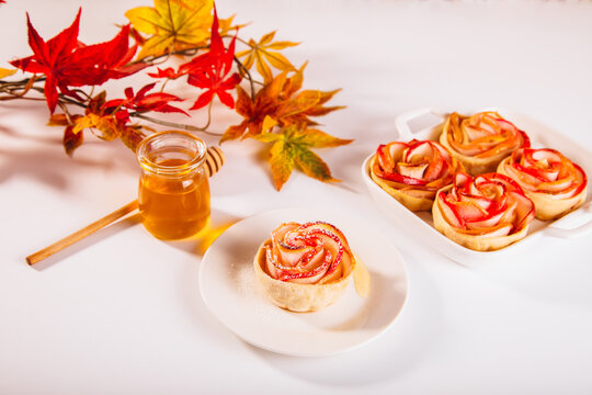 Delicious rose-shaped apple dessert with honey