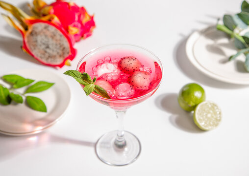 Refreshing dragon fruit cocktail with mint garnish