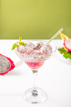 Refreshing dragon fruit cocktail with mint garnish