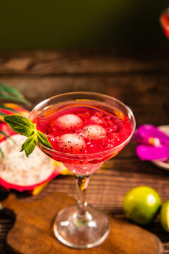 Vibrant dragon fruit cocktail with mint garnish