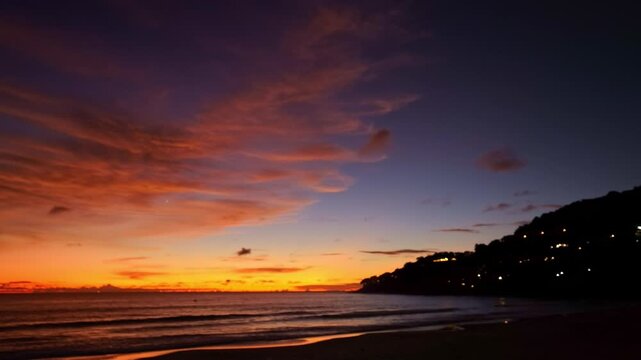 aerial view of exotic sweet sky in sunset at Karon beach Phuket.
Scene of colorful romantic sky sunset with changing the brilliant yellow sky gradually turned red. 
4k video travel concept.