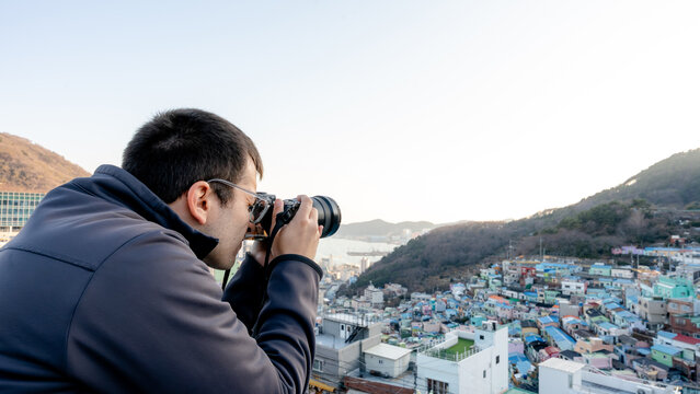 Photographer capturing Gamcheon Culture Village in Busan