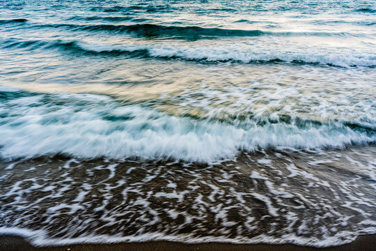 long exposure of waves crashing on beach