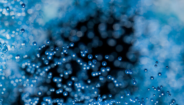Abstract blue 3D spheres floating in soft bokeh background