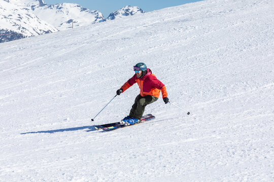 Skiing enthusiast on snowy mountain slope