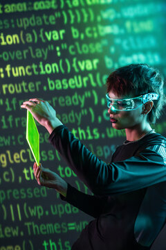 Cyberpunk young woman using VR glasses with neon interface