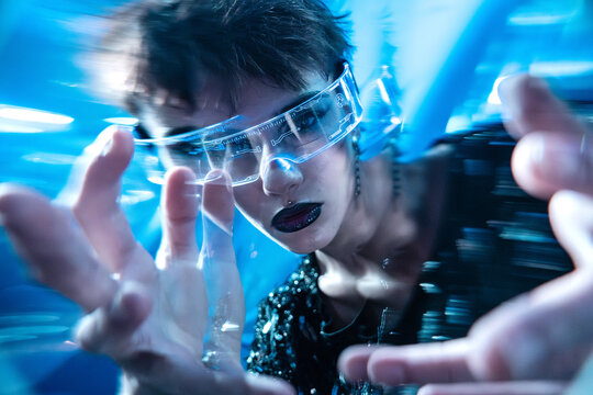 Futuristic cyberpunk young woman using VR headset interface