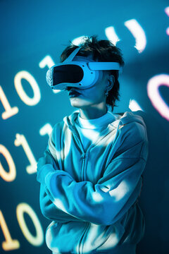 Cyberpunk young woman using VR headset in neon light