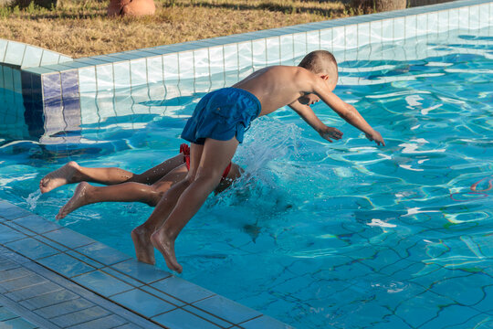 Children enjoying summer vacation at the pool
