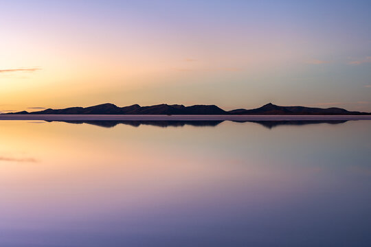 Serene sunset at the Uyuni salt flats in Bolivia