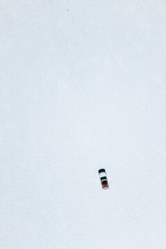 Solitary vehicle on Uyuni salt flats, Bolivia