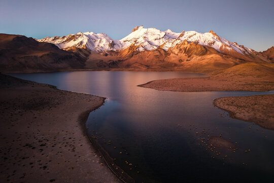 Sunset view of Laguna Casiri and Kunturiri peaks, Chile