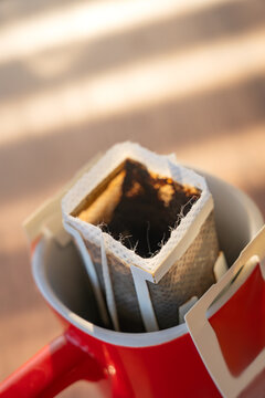 Pour-over coffee filter in red mug for mindful moments