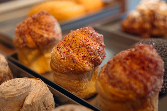 Fresh cruffin filled with vanilla custard and berry jam