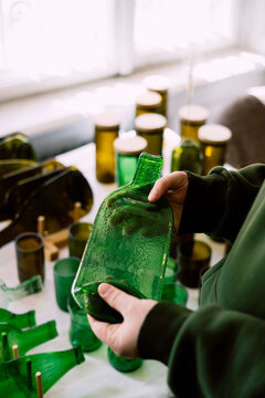 Artisan crafting fused glass from recycled materials