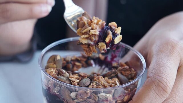 Enjoying a simple yogurt parfait with granola and berries