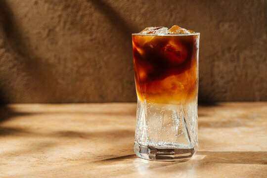 Espresso tonic refreshing drink with ice cubes