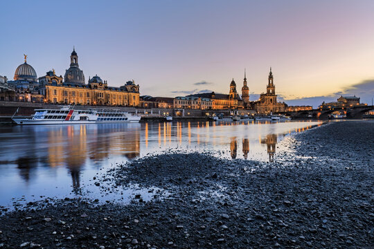 Dresden's historic skyline at sunset reflecting in Elbe