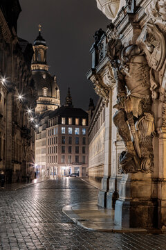 Dresden's baroque sculptures and historic buildings at night