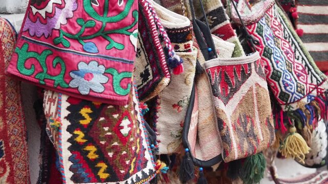 Beautiful bags and rugs in a busy market in Morocco