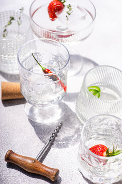 Summer champagne cocktail with strawberry, chilli and thyme
