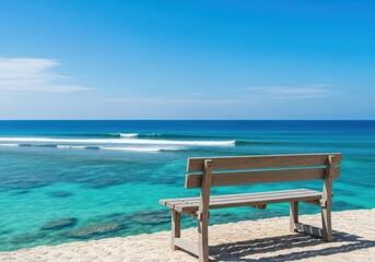 Fototapeta premium A peaceful wooden bench sits overlooking a stunning tropical ocean vista under clear blue sky, evoking calm and perfect relaxation, paradise, summer, horizon