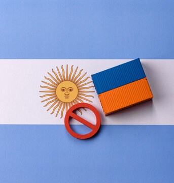 The cargo container ban on the Argentina flag as a conceptual backdrop. The cargo container embargo