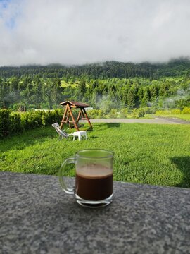 Coffee cup with Piatra Craiului Mountains landscape in Zarnesti, Romania