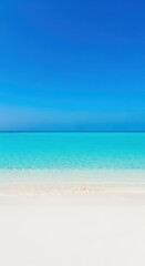 Obraz premium Pristine white sand meeting crystal-clear turquoise ocean waters under a brilliant blue sky, defining the perfect tranquil tropical getaway setting, destination, blue, outdoor