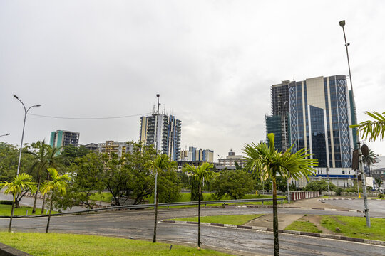 Douala, Cameroon - 28 April 2025: View of modern skyscrapers and office buildings under an overcast sky in the city center.