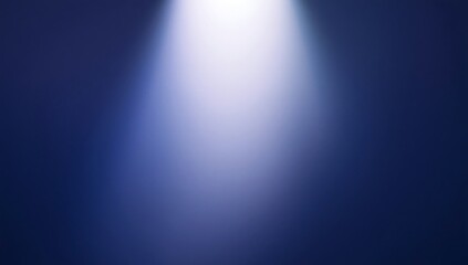 Obraz premium Soft white spotlight glowing on dark blue background surface with spotlight background abstract minimalist