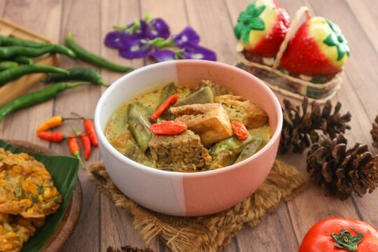 Orem‑orem, a traditional dish from Malang in East Java, a part of Indonesian cuisine. Made with tempeh or tofu, eggplant, bird's eye chilies, and thin coconut milk infused with turmeric.