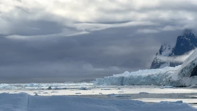 Dramatic Antarctic Coastline with Brash Ice, Glaciers and Rocky Peaks, Antarctica