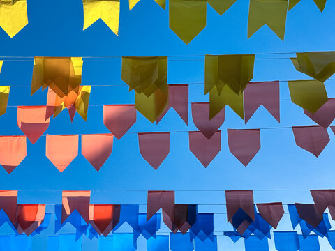 Party flags against blue sky