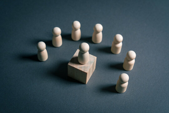 Leader guiding team members from central position in collaborative group