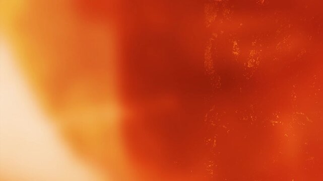 Cinematic solarized orange flare backdrop with aged film specks