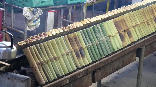 Glutinous rice roasted in bamboo joints (Khao Lam), Thai traditional snack  