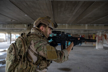 Fototapeta premium Special armed military squad team in full gear patrolling an abandoned building during hostage crisis